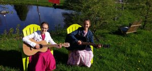 Amanda and Vanessa playing guitars